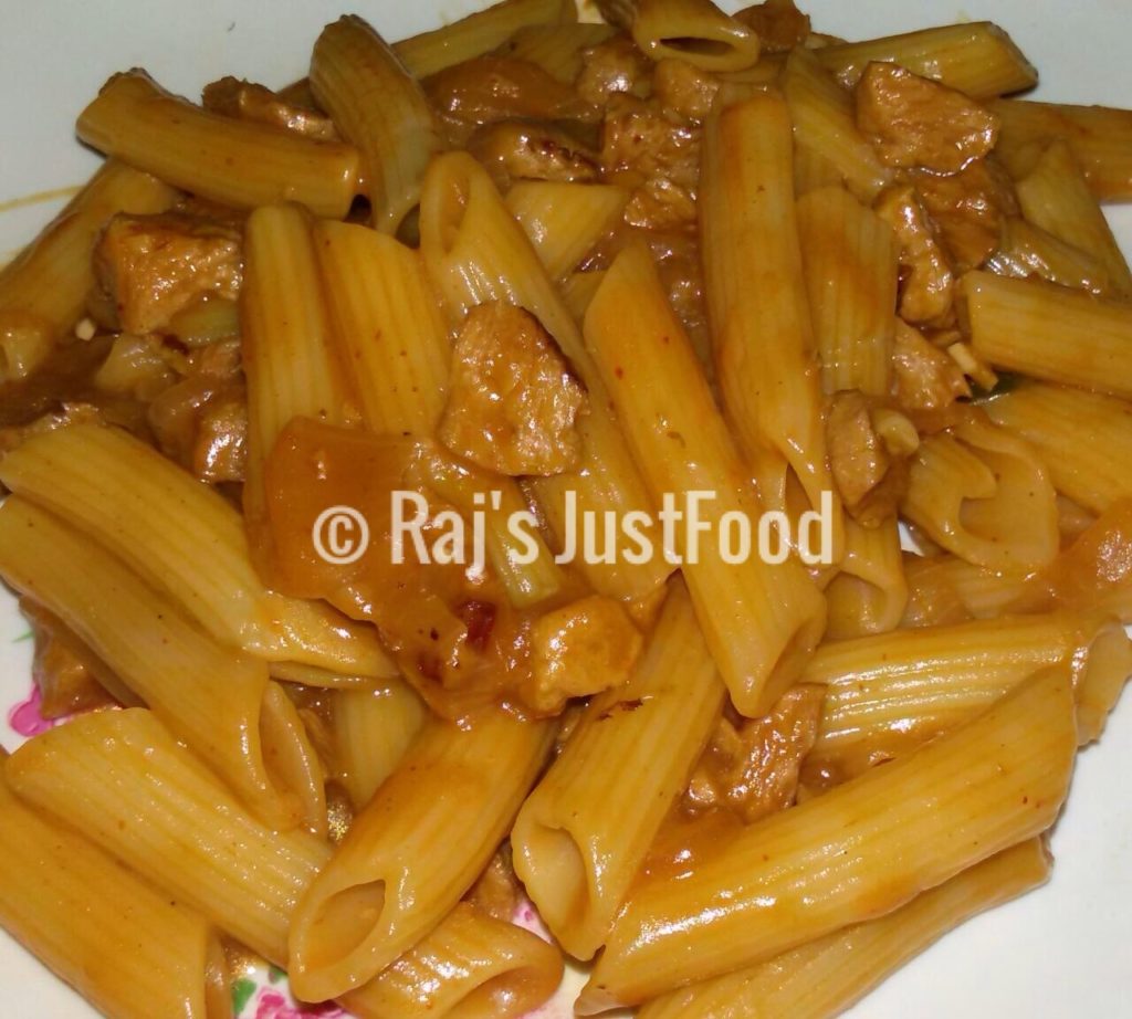 Chicken pasta in spicy red sauce